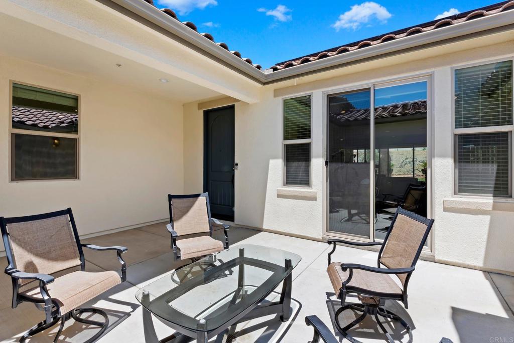 22089 Gallop Way Escondido, CA 92029 - Photo 4 of 43 a view of a chairs and table in a patio