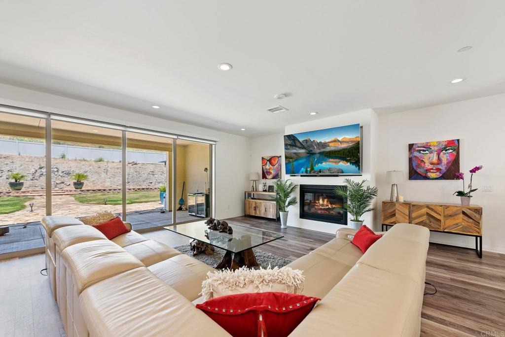 22089 Gallop Way Escondido, CA 92029 - Photo 5 of 43 a living room with fireplace furniture and a large window