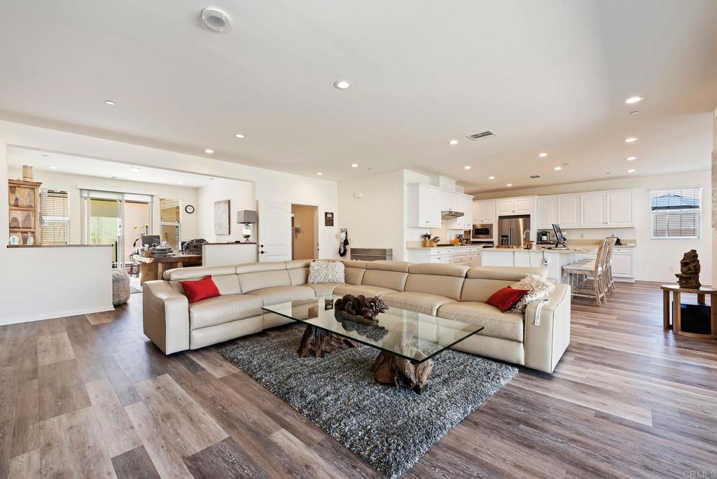 22089 Gallop Way Escondido, CA 92029 - Photo 6 of 43 a living room with lots of furniture and view of kitchen