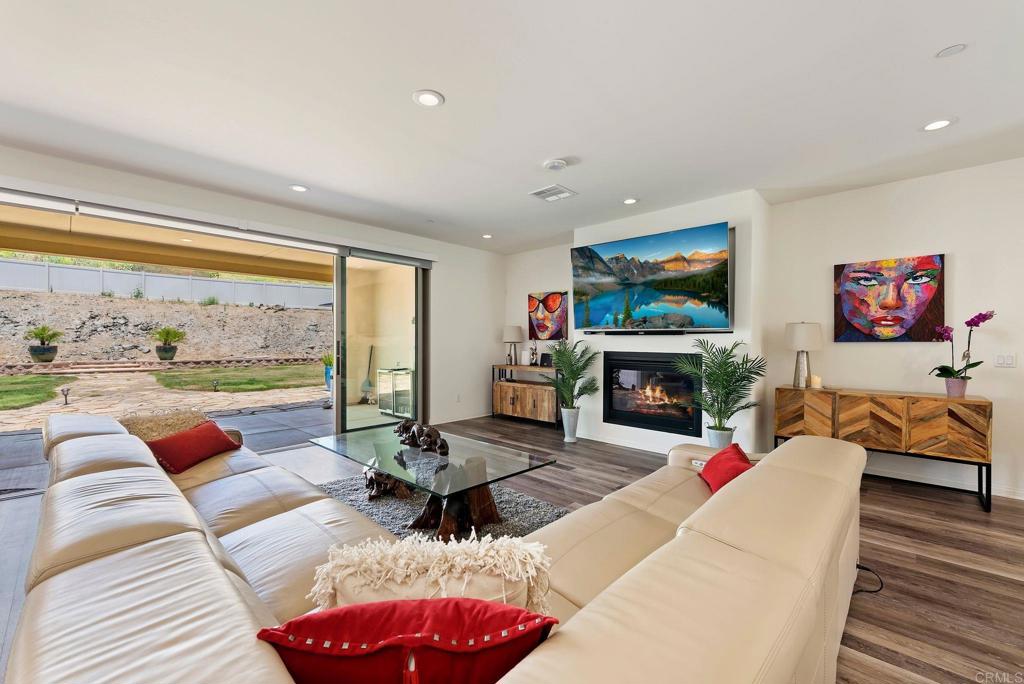 22089 Gallop Way Escondido, CA 92029 - Photo 7 of 43 a living room with furniture fireplace and a large window