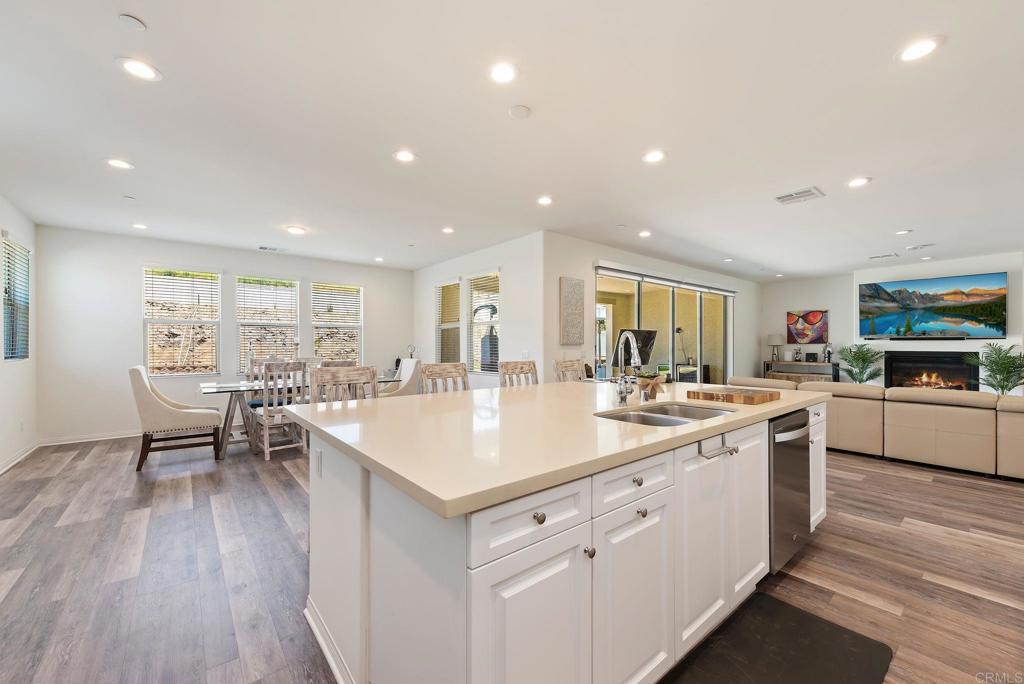 22089 Gallop Way Escondido, CA 92029 - Photo 10 of 43 a large white kitchen with a table and chairs
