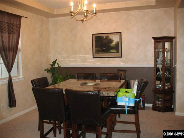 10612 Fire Poppy Circle Reno, NV 89521 - Photo 6 of 9 a dining room with furniture and window