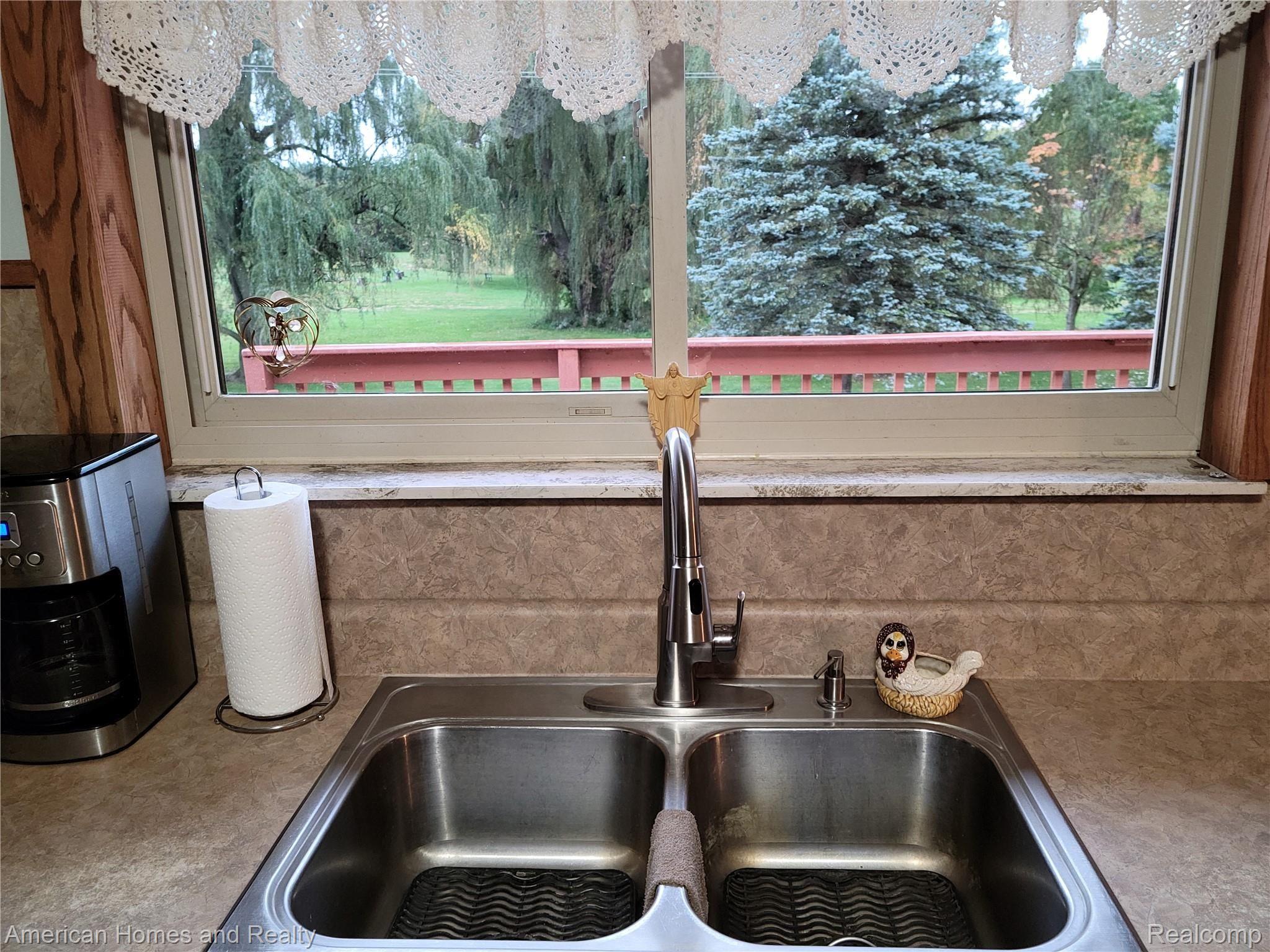 6530 Armstrong Road Imlay City, MI 48444 - Photo 17 of 59 Relaxing view of nature through kitchen sink window