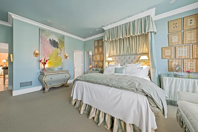 a bedroom with a bed and glass window