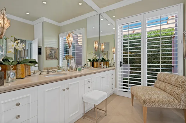 a spacious bathroom with a granite countertop sink and a large mirror