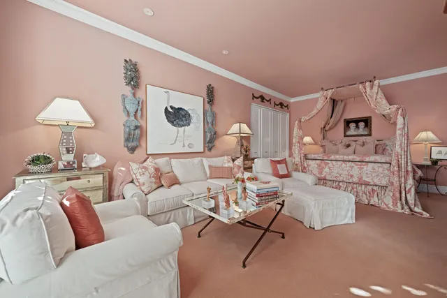 a living room with furniture and a lamp