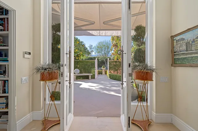 a view of a balcony with wooden floor and outdoor space
