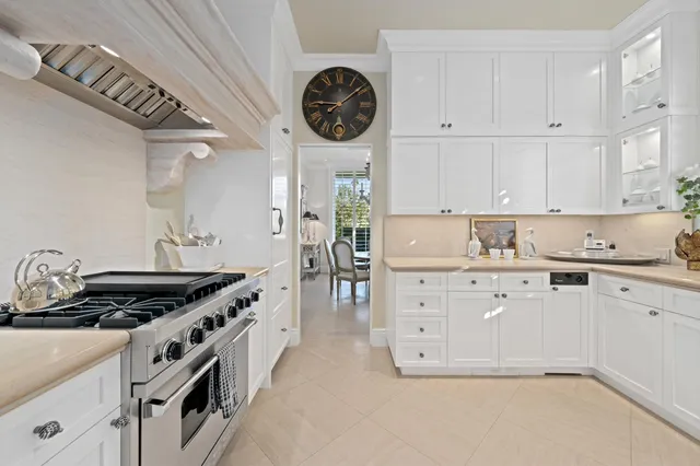 a kitchen with granite countertop a stove and a sink