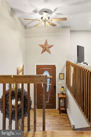 a bedroom with two beds and painting on the wall