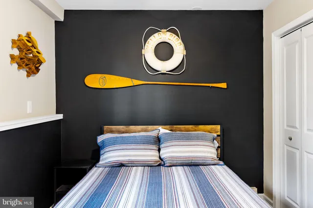 a view of a lake with houses in the background