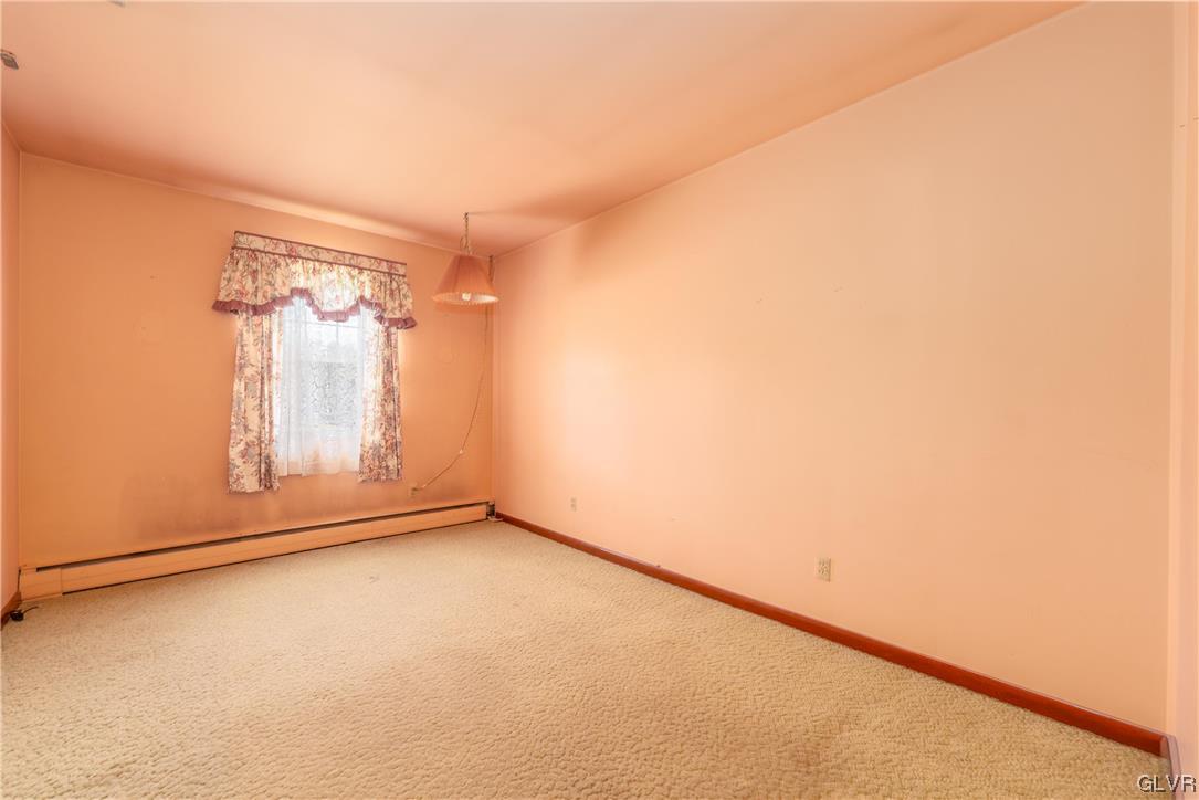 6991 Hilltop Road Allentown, PA 18106 - Photo 11 of 26 an empty room with a door