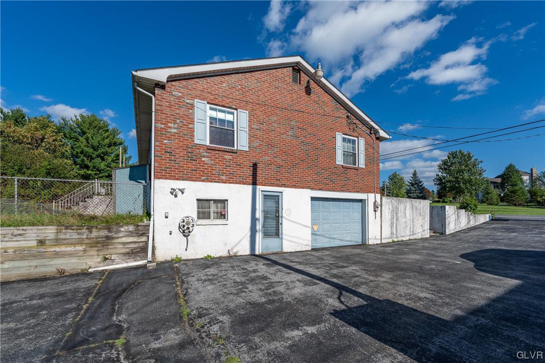 6991 Hilltop Road Allentown, PA 18106 - Photo 17 of 26 a front view of a house with a yard
