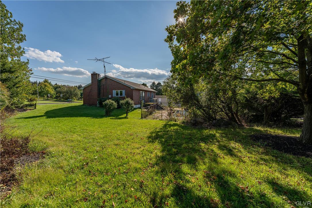 6991 Hilltop Road Allentown, PA 18106 - Photo 19 of 26 a view of an outdoor space and a yard