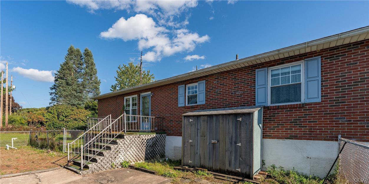 6991 Hilltop Road Allentown, PA 18106 - Photo 20 of 26 a front view of a house with a yard