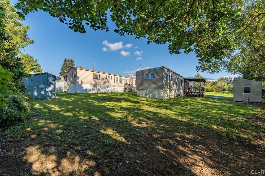 6991 Hilltop Road Allentown, PA 18106 - Photo 24 of 26 a view of a house with a big yard