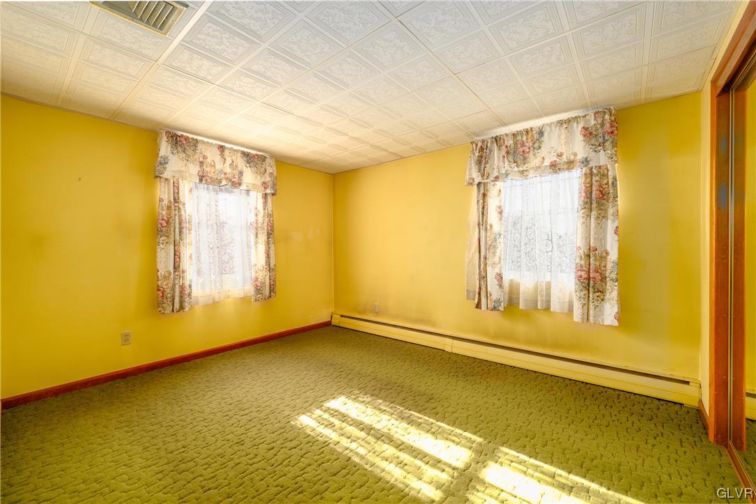 6991 Hilltop Road Allentown, PA 18106 - Photo 9 of 26 a view of an empty room with a window