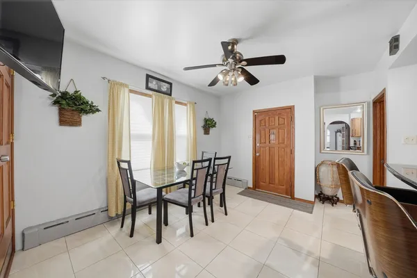 a view of a dining room with furniture and a window