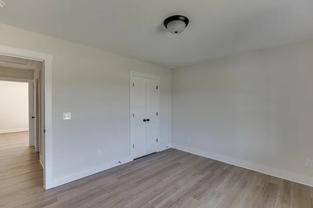 a view of a room that has wooden floor