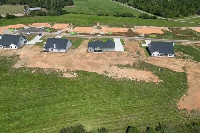 a view of a lake with a yard