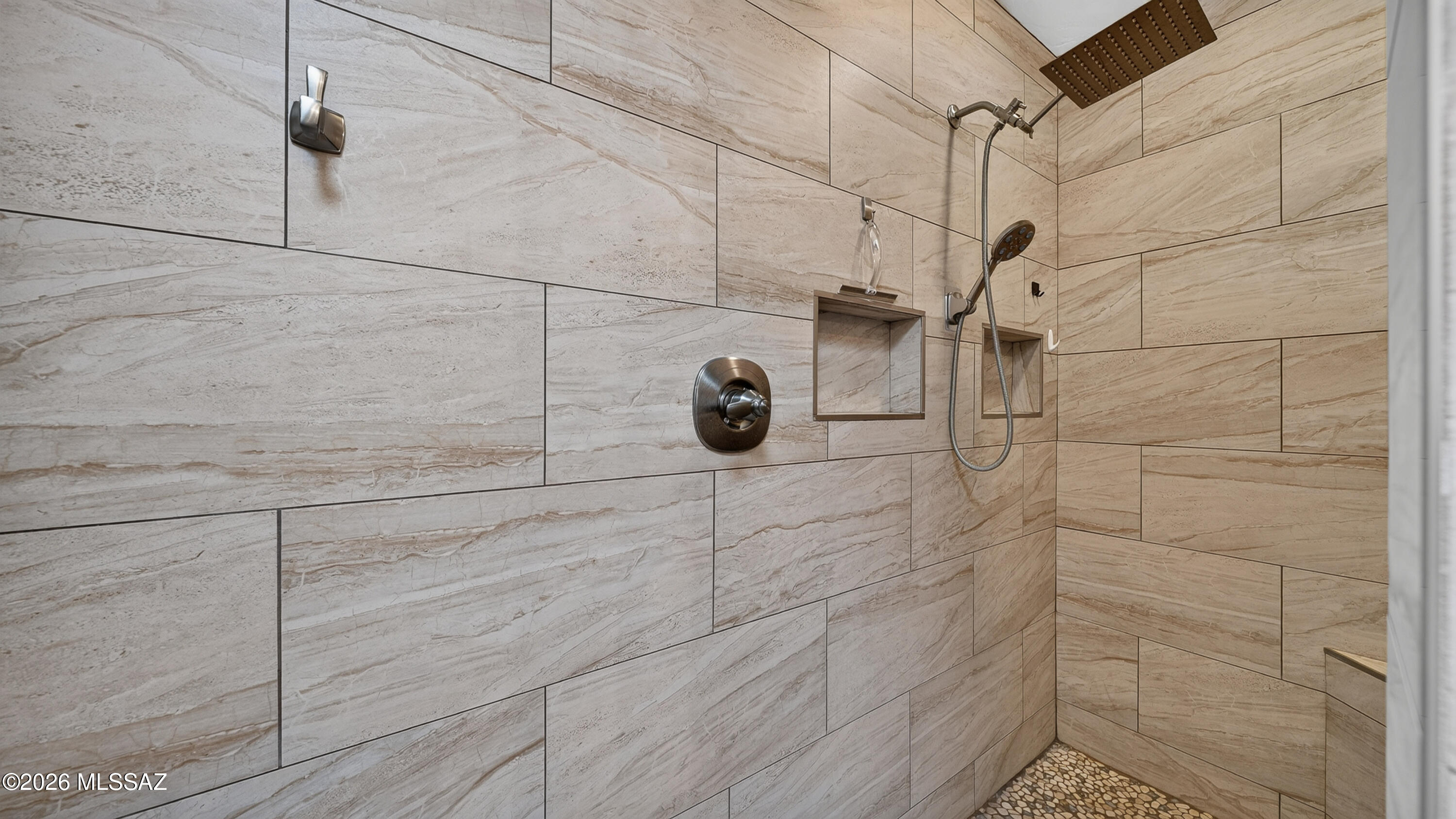 194 Taylor Road Willcox, AZ 85643 - Photo 28 of 54 Primary bathroom features a European-style doorless walk-in shower with full tile surround, built-in shower niches, a rain showerhead, and handheld sprayer.