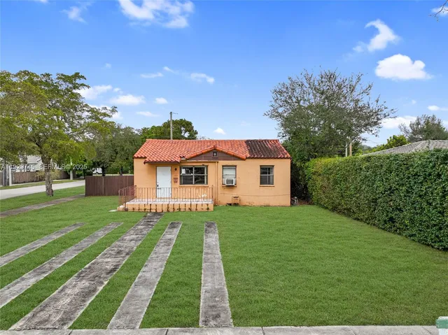 a front view of a house with yard