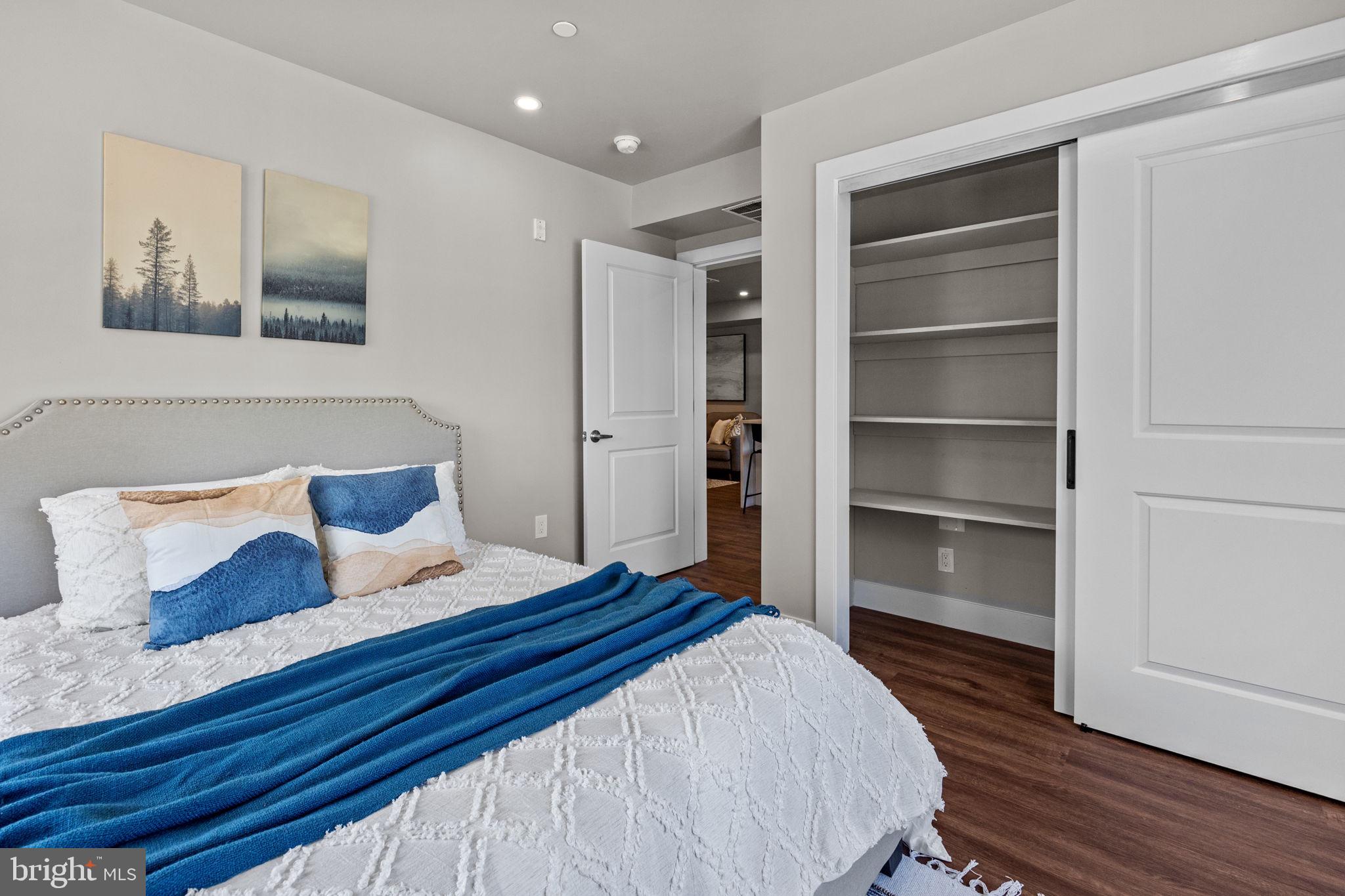 77 East Pastorius Street, Unit 1 Philadelphia, PA 19144 - Photo 16 of 43 a bedroom with a bed and a view of kitchen