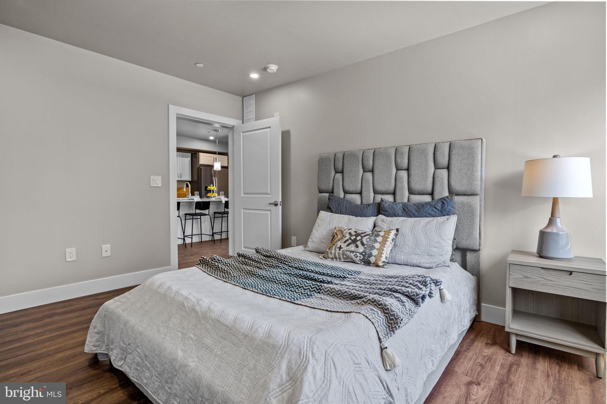 77 East Pastorius Street, Unit 1 Philadelphia, PA 19144 - Photo 18 of 43 a bedroom with a bed and a night stand