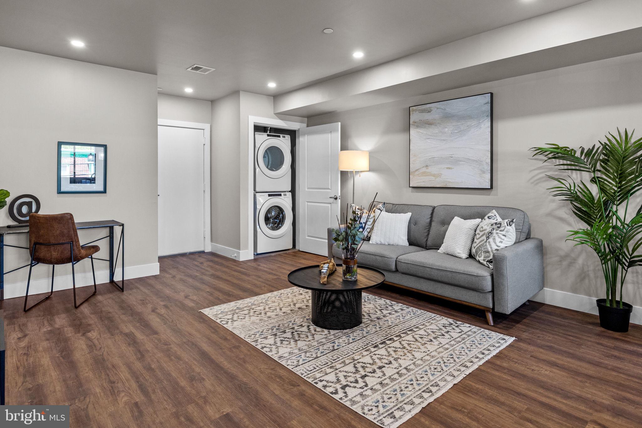 77 East Pastorius Street, Unit 1 Philadelphia, PA 19144 - Photo 20 of 43 a living room with furniture and a wooden floor