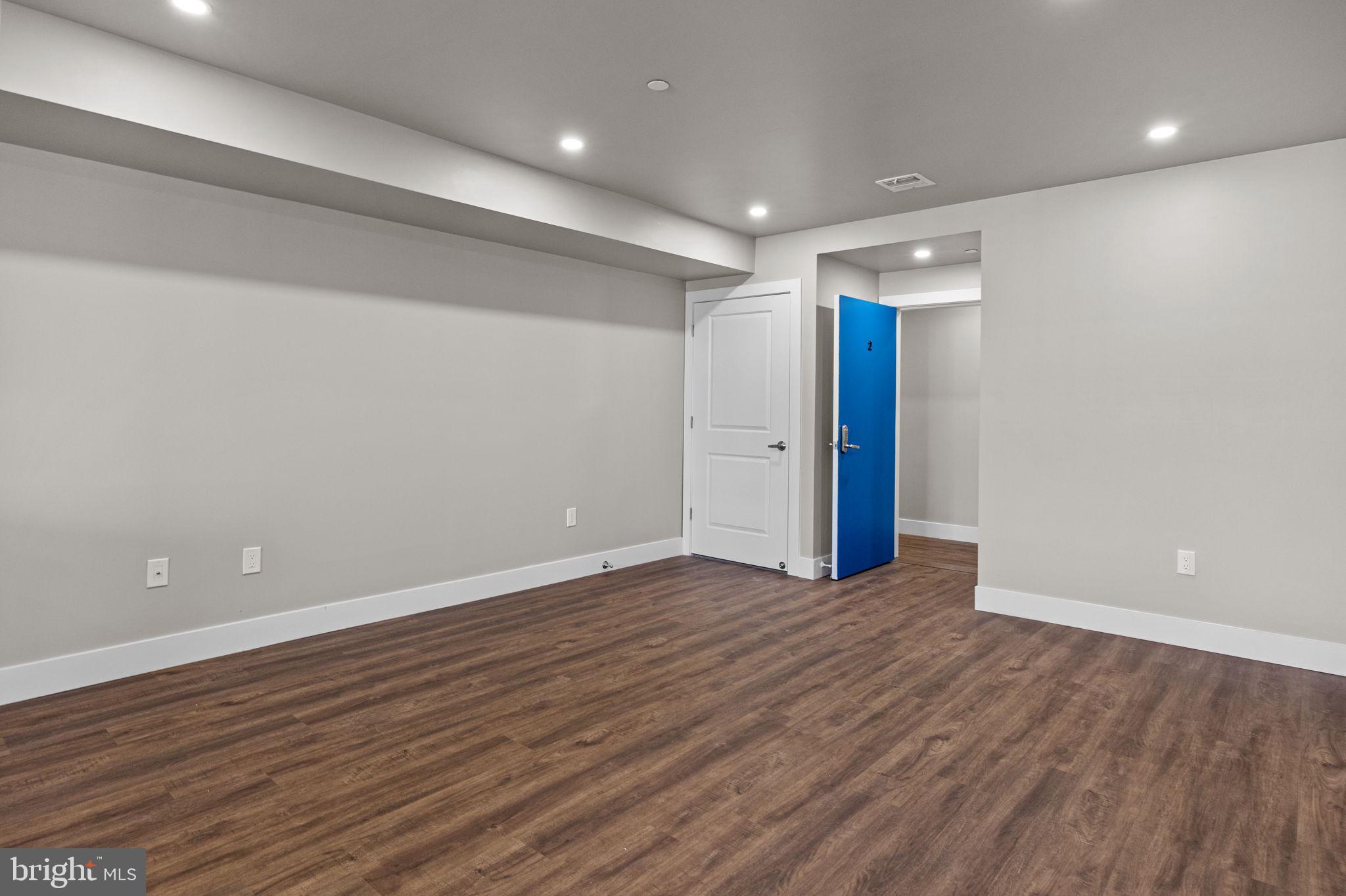 77 East Pastorius Street, Unit 1 Philadelphia, PA 19144 - Photo 29 of 43 an empty room with wooden floor and natural light