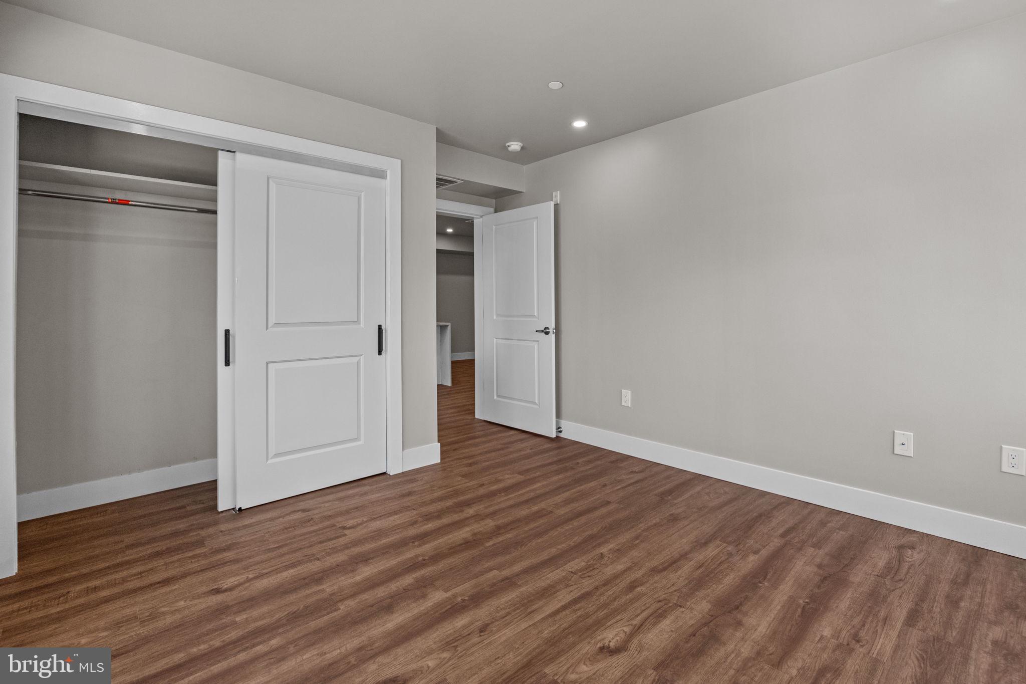 77 East Pastorius Street, Unit 1 Philadelphia, PA 19144 - Photo 37 of 43 a view of an empty room with wooden floor