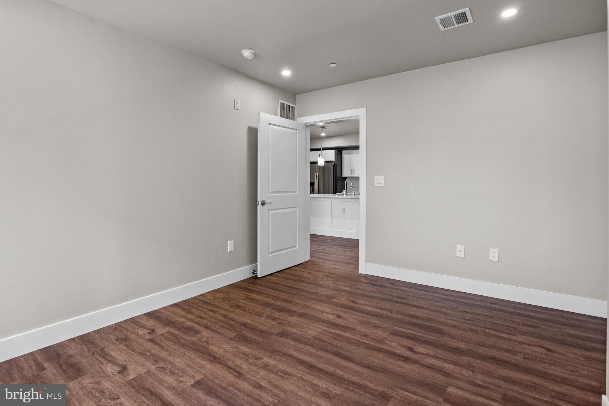 77 East Pastorius Street, Unit 1 Philadelphia, PA 19144 - Photo 39 of 43 a view of empty room with wooden floor