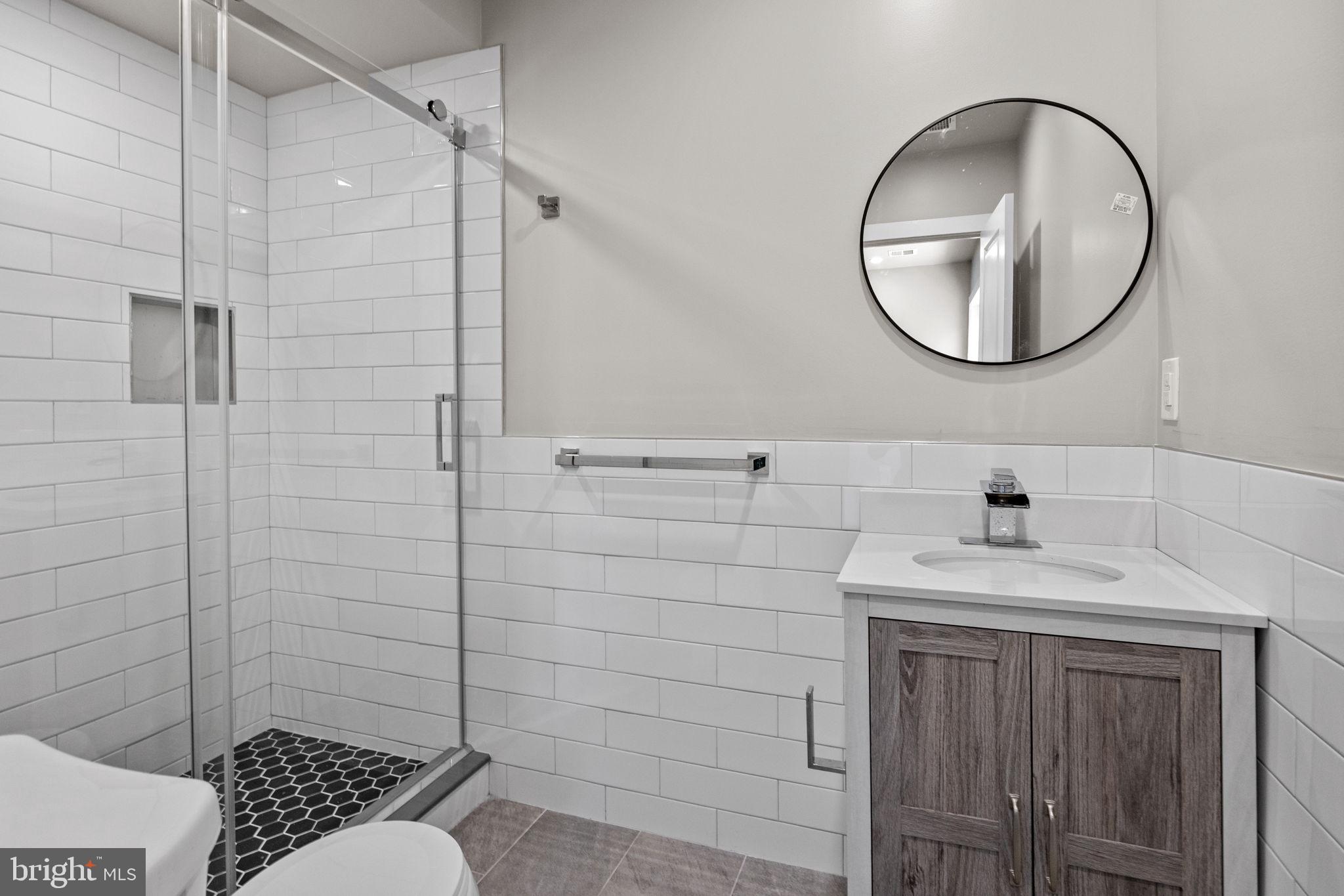 77 East Pastorius Street, Unit 1 Philadelphia, PA 19144 - Photo 40 of 43 a bathroom with a sink toilet and shower