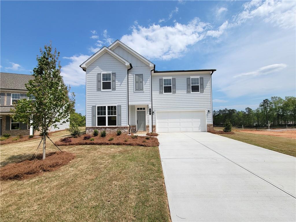 74 Everly Way Bethlehem, GA 30620 - Photo 1 of 1 a front view of a house with garden