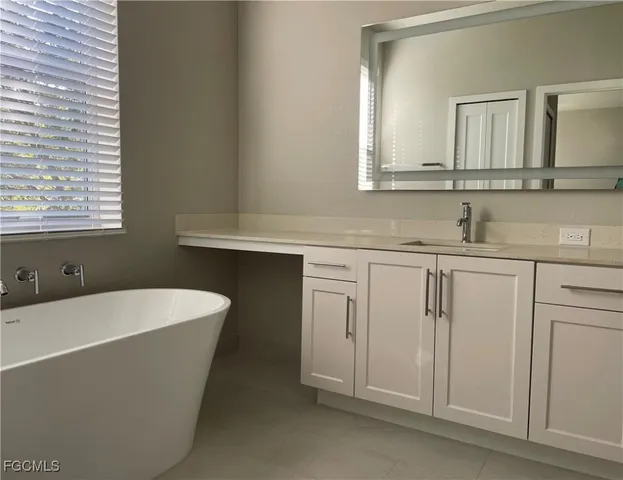 a bathroom with a sink and a bathtub