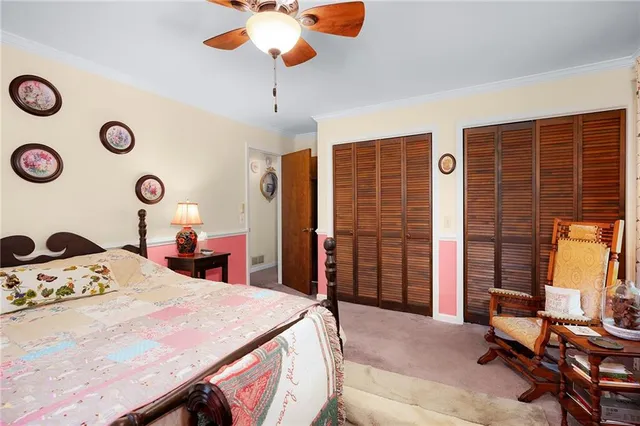 a bedroom with a bed and a table