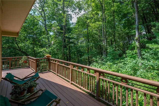 a view of a two chairs in the balcony