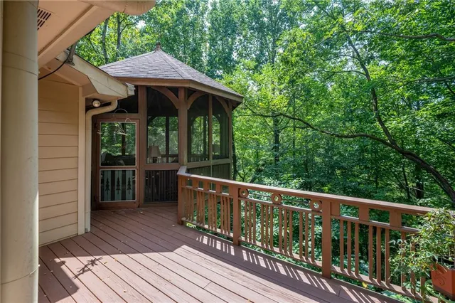 a view of a wooden deck with a table and chairs