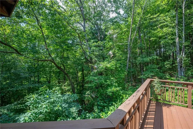a balcony with wooden fence