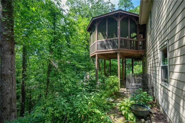 a view of a chair and table in the balcony