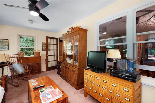 a living room with furniture fireplace and flat screen tv
