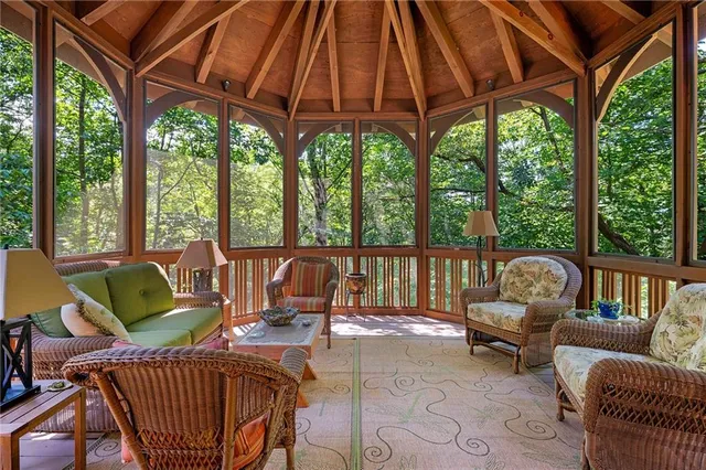 a view of a patio with a table chairs and a umbrella