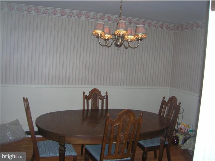 203 Grubb Road Pottstown, PA 19465 - Photo 8 of 25 a dining room with furniture and chandelier
