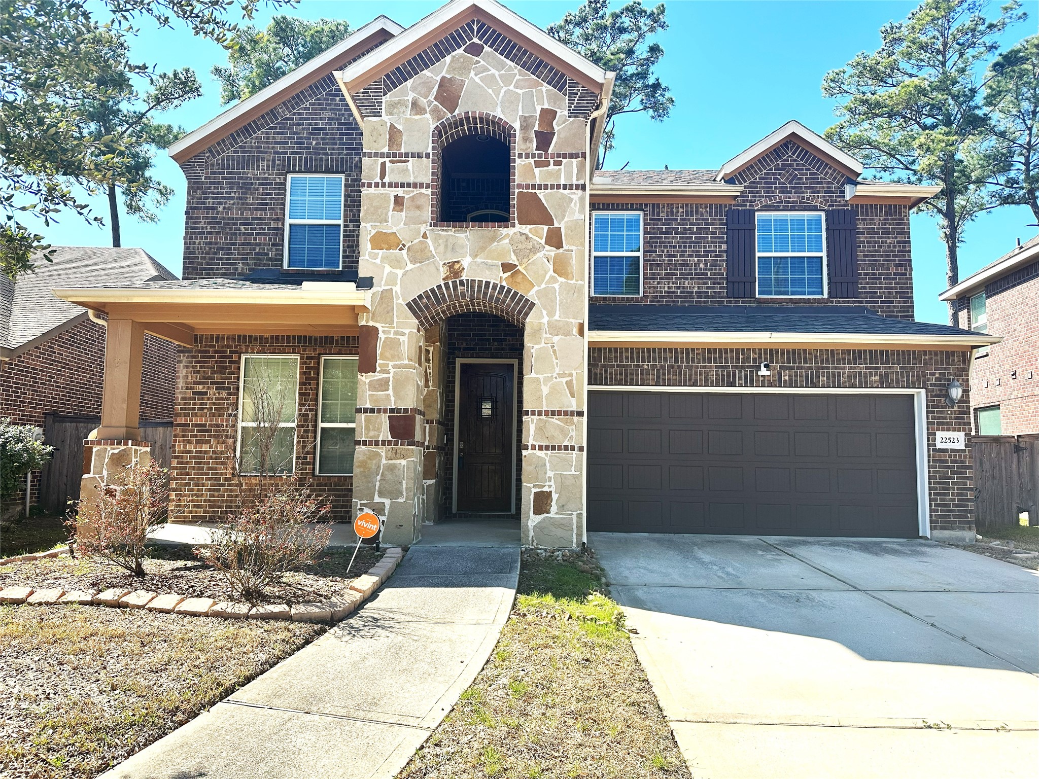 a front view of a house with yard