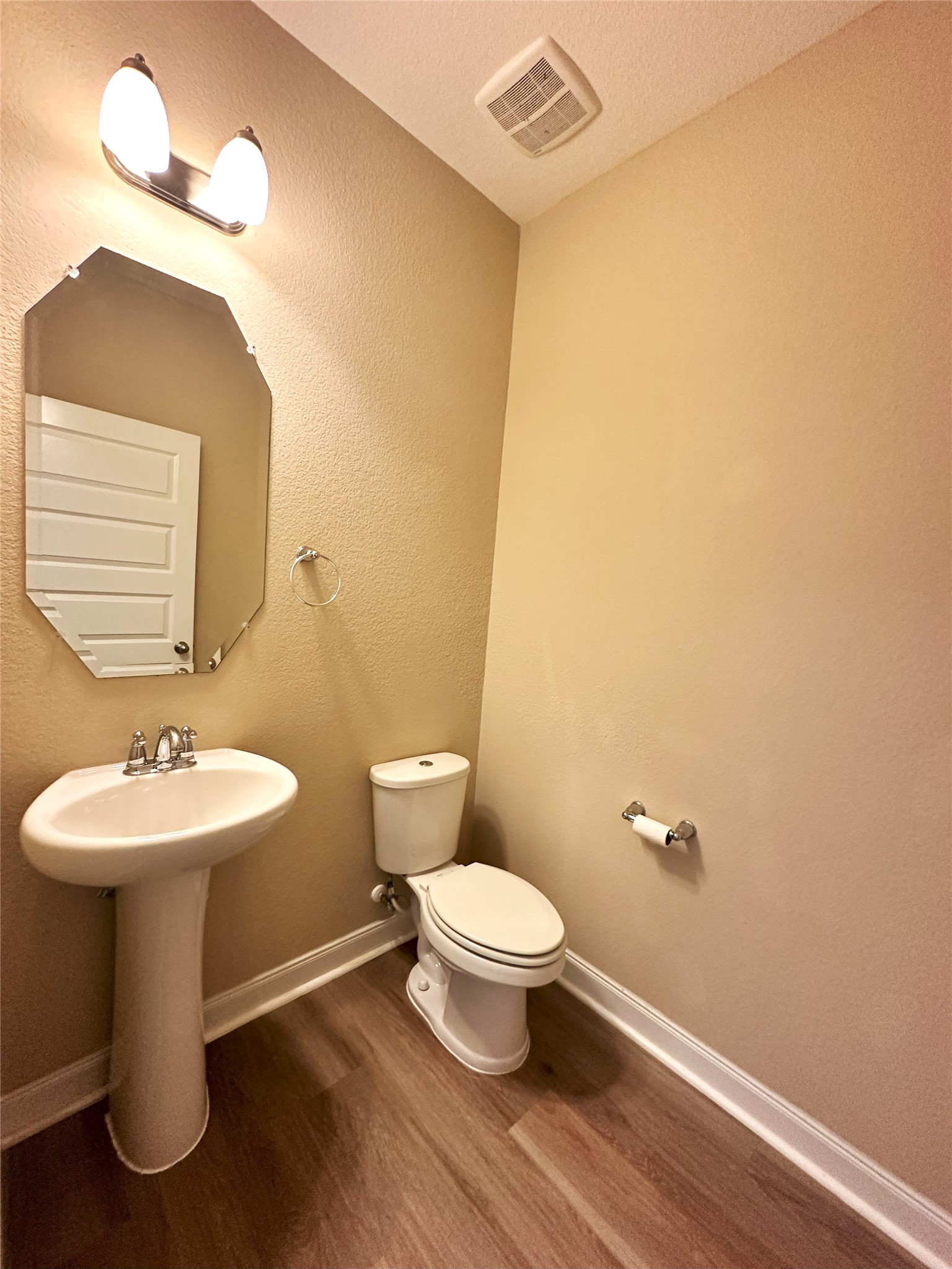 22523 Birch Ridge Meadow Drive Spring, TX 77389 - Photo 11 of 33 a bathroom with a toilet sink and mirror