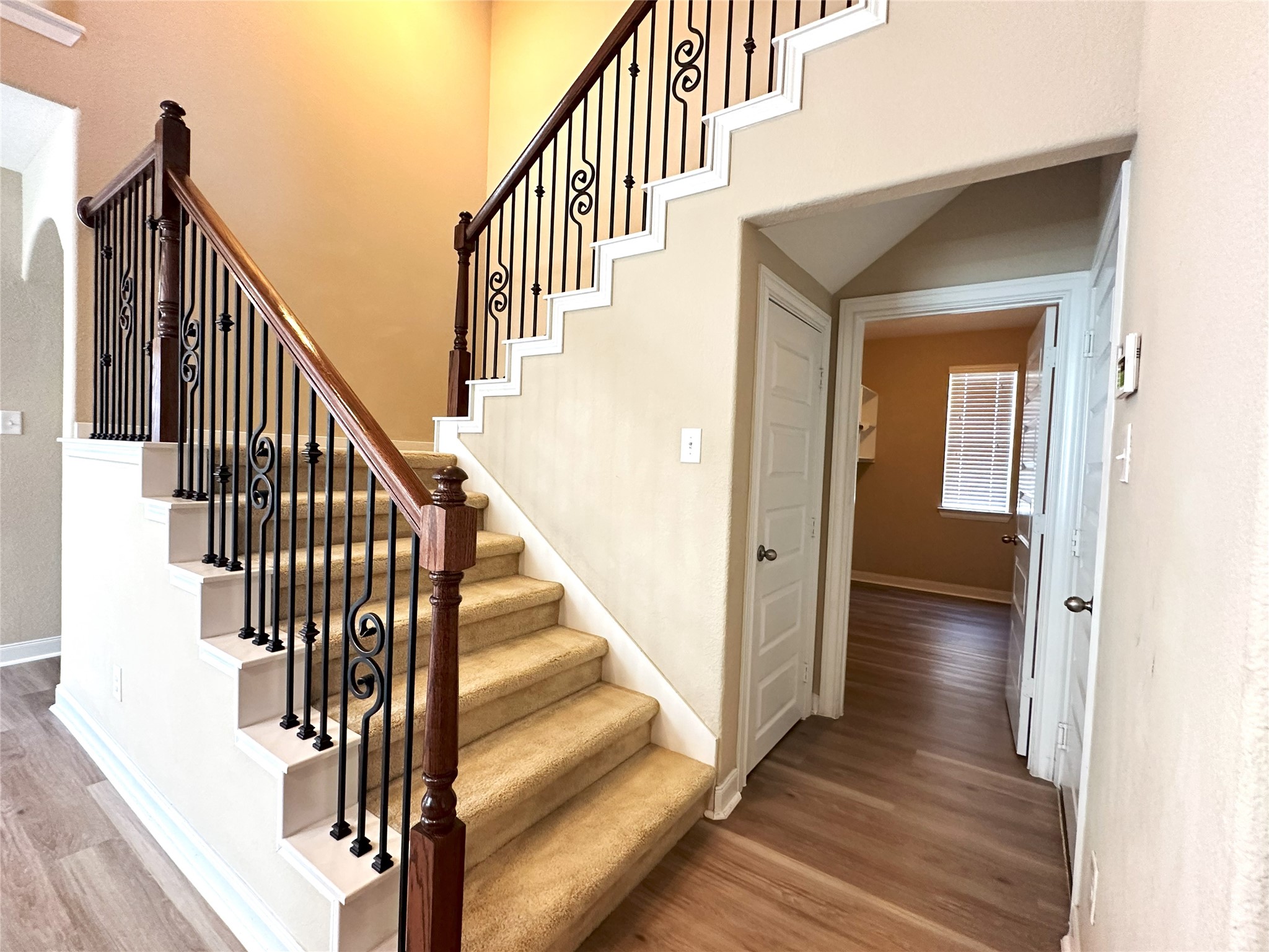 22523 Birch Ridge Meadow Drive Spring, TX 77389 - Photo 21 of 33 a view of a hallway with wooden floor and staircase