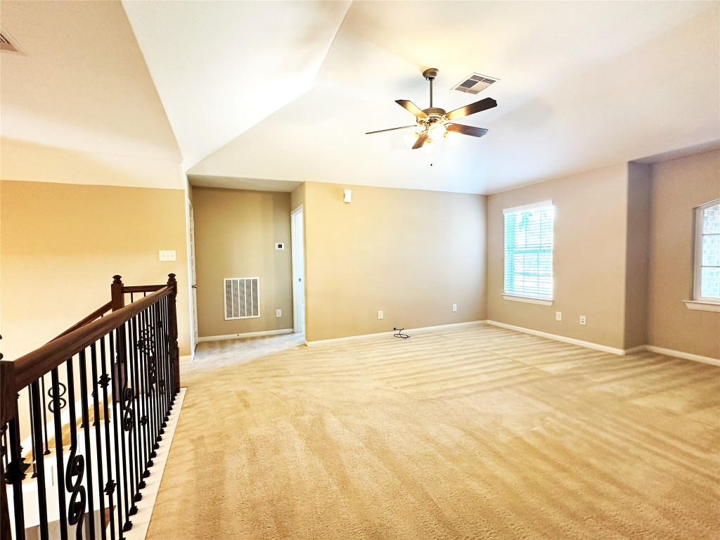22523 Birch Ridge Meadow Drive Spring, TX 77389 - Photo 23 of 33 a view of an empty room with wooden floor and a window