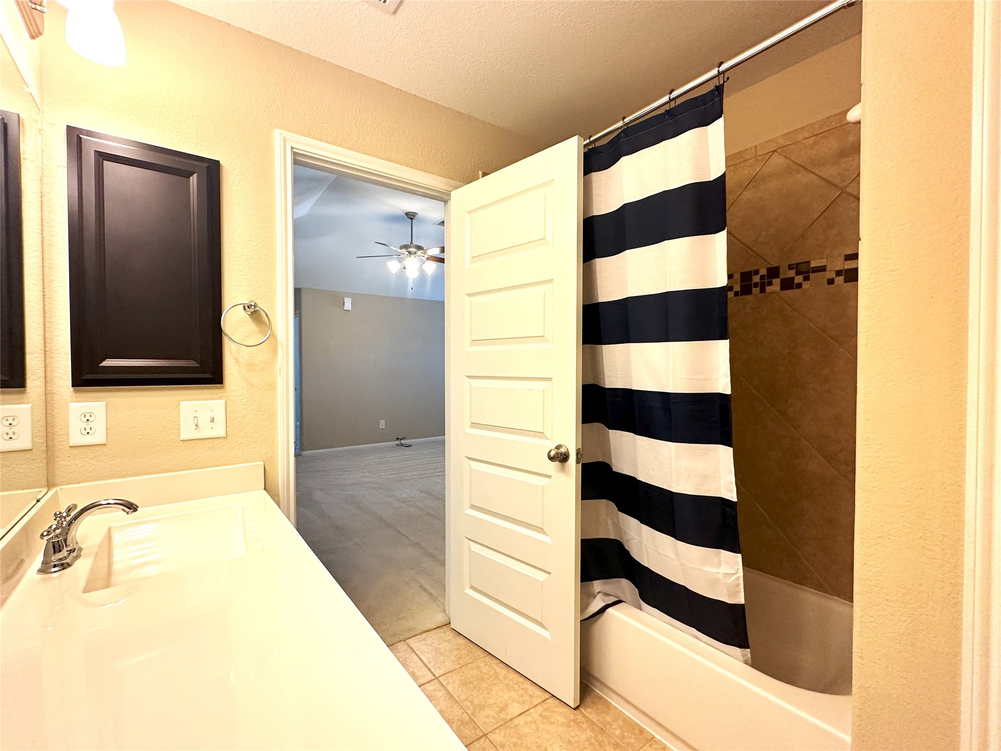 22523 Birch Ridge Meadow Drive Spring, TX 77389 - Photo 26 of 33 a bathroom with a bathtub and a shower