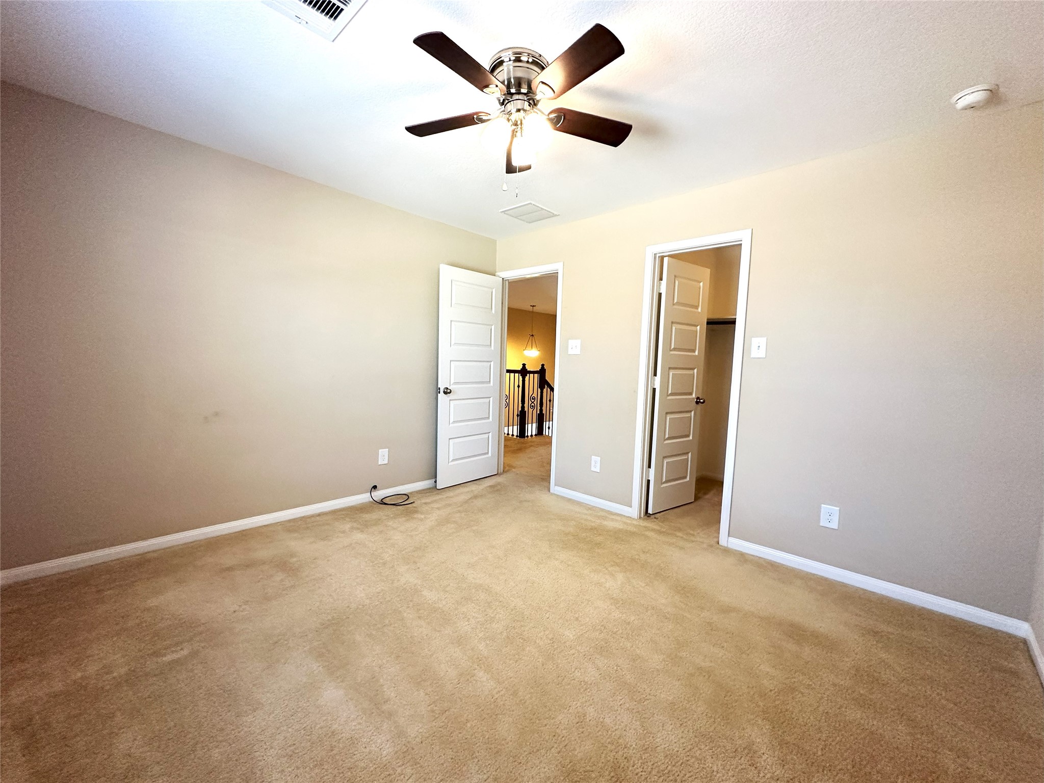 22523 Birch Ridge Meadow Drive Spring, TX 77389 - Photo 29 of 33 an empty room with closet and a ceiling fan