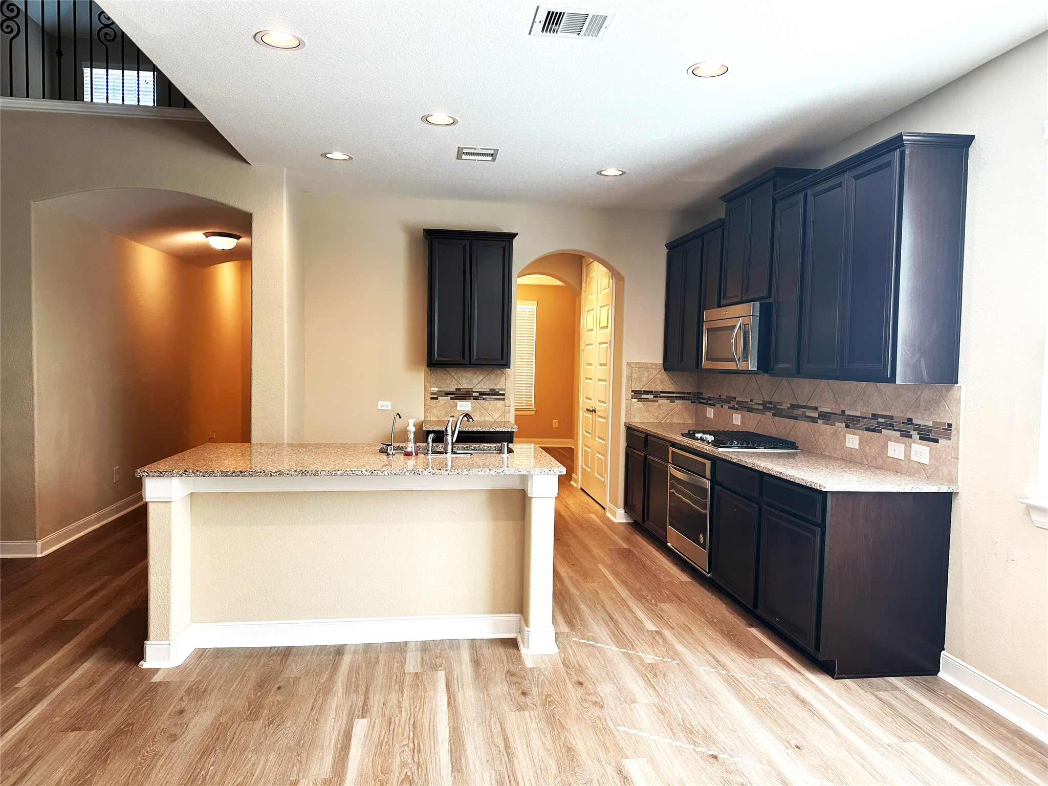 22523 Birch Ridge Meadow Drive Spring, TX 77389 - Photo 3 of 33 a kitchen with stainless steel appliances granite countertop a sink stove and refrigerator
