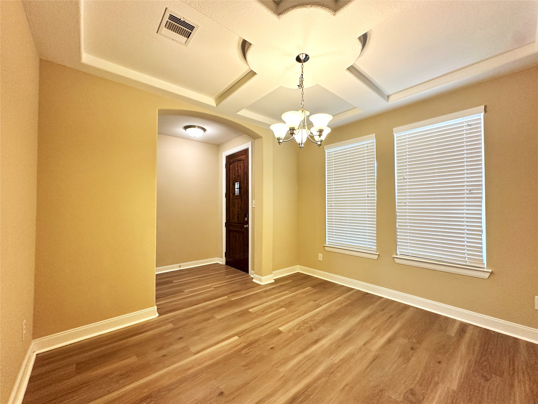 22523 Birch Ridge Meadow Drive Spring, TX 77389 - Photo 6 of 33 a view of a livingroom with a chandelier fan and windows